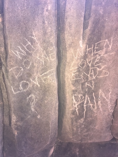 An empowering message carved at the base.