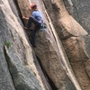 Begin the route on London Bridges and go around the arete at the horizontal crack