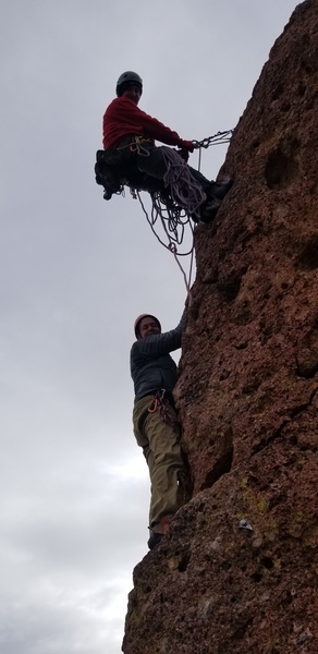 Clint Mortenson Belaying his partner up Jugorknot on Greevers' Needle