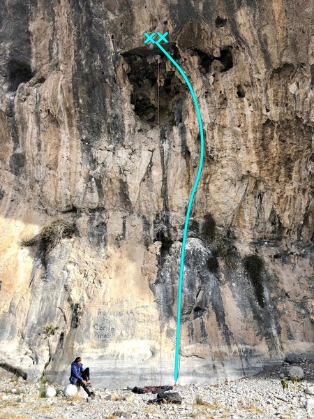 The route ascends the slab to a detached tufa / stalactite and then into a large hueco.