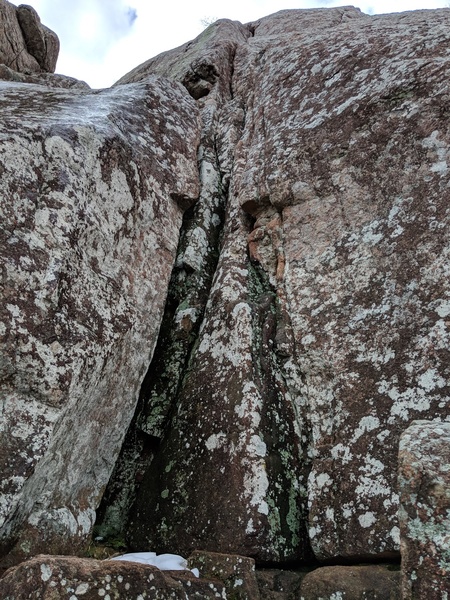 A slightly wet, slightly snowy belay at the base of "Yee Haw"