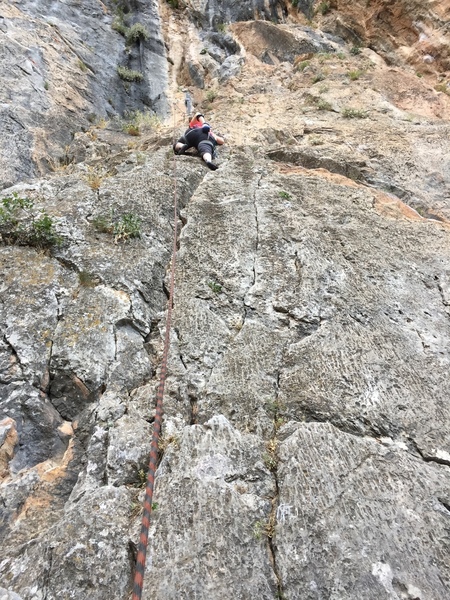 Michelle warming up on Levedakos, 5.7, at Mouzaki in northern Greece.
