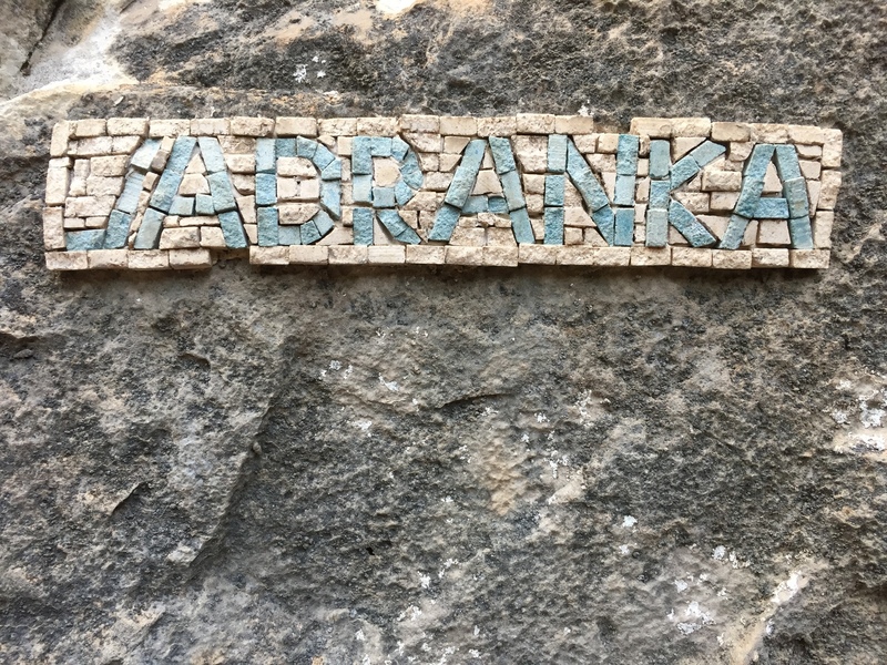 An example of the tile-work which lists the route names at Mouzaki in northern Greece.