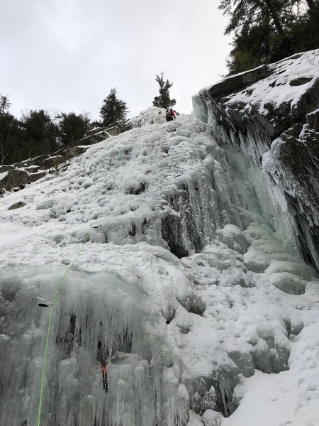 Nick climbing the 1st pitch of the climb, near the top of the bottom half of the falls