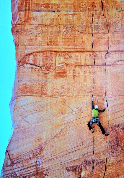 Chris Tatum on the first lead of the 3rd pitch of Direct Flight. He rated this pitch 5.10+. John Burcham photo originally appeared in the Alpinist issue 33 article titled "Still Life with Sand", with words by Andrew Frost.