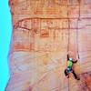 Chris Tatum on the first lead of the 3rd pitch of Direct Flight. He rated this pitch 5.10+. John Burcham photo originally appeared in the Alpinist issue 33 article titled "Still Life with Sand", with words by Andrew Frost.