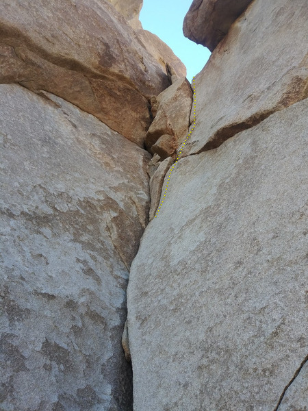 (Top) Upper section of the crack. I'm assuming the route would end at the ledge. (No cracks up Frock proper, unless traversing right into Commitment Time is possible?