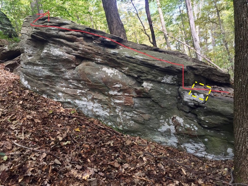 Start with your hands on the lower ledge all the way on the right (yellow box), hook a heel and then keep on hooking! (there;s a few good pockets for your feet along the way too.