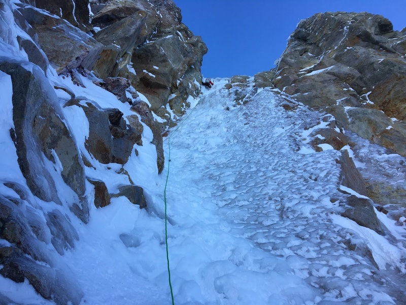 While belaying, Andy Traylor took a piece of ice to the spine and got a numb shooting of tingles all throughout his body. <br>
He still managed to take photos because he’s a champion.