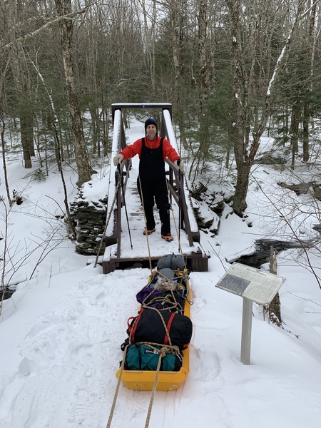 Sledding climbing gear into the Black Chasm from Platt Cove Road. Winter 2019. A major back saver!
