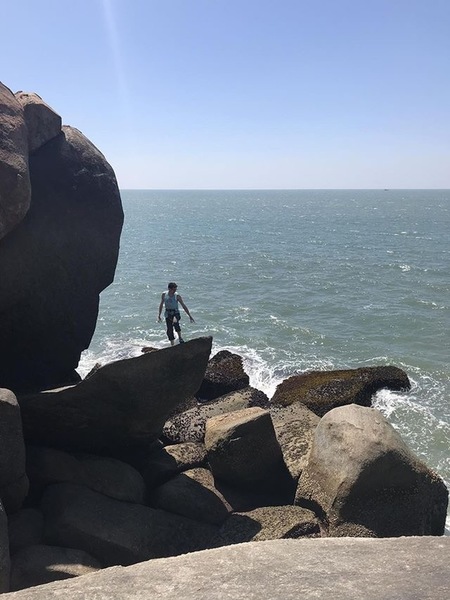 From above, pointing at the waves below (this is at low tide)