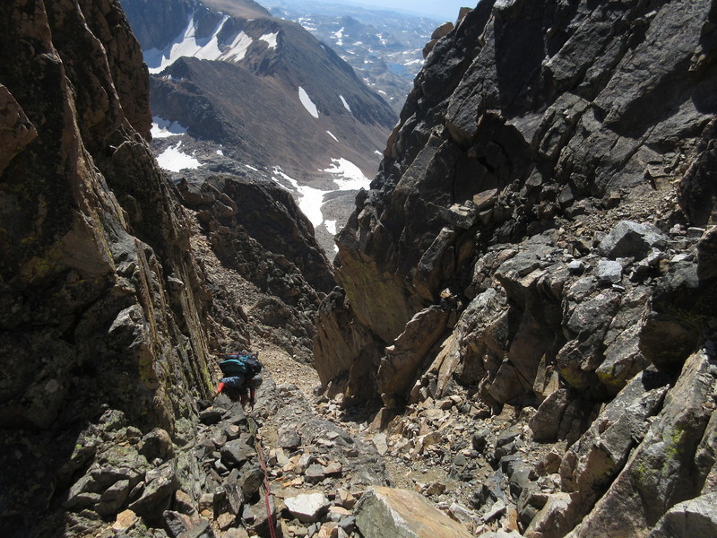 Charlotte descending the loose chute beneath the cl. 4 downclimb, before more enjoyable cl. 3-4 ridge scrambling.