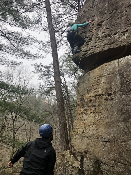 Bethany climbing the crux, stick clipped to the second bolt