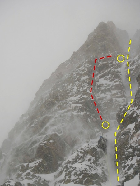 A climber on pitch 1 of Tastee Freeze, Feb./Mar. 2019. The route follows the spindrift. The dihedral variation to pitch 2 (red) looks inviting but becomes very loose halfway up. Not recommended.
