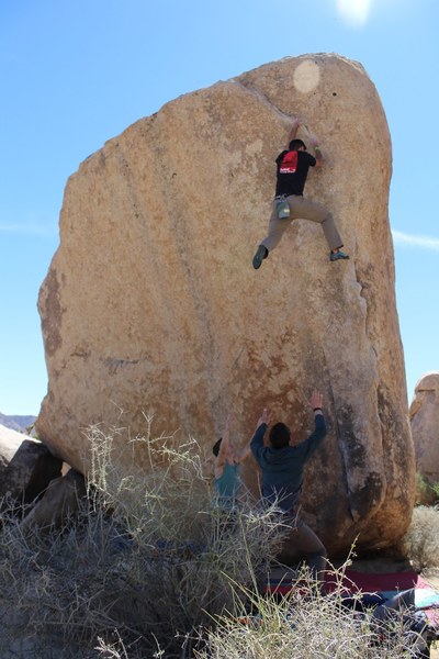 Cutting feet on the crux.