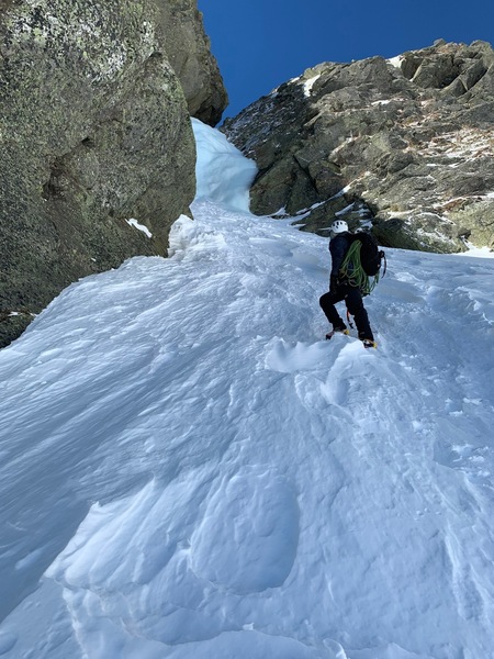 Parker looking up the first pitch of ice on Pinnacle Gully