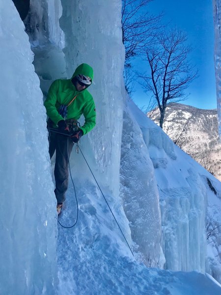 Belaying from the bolts in the right of the cave (Standard Route)