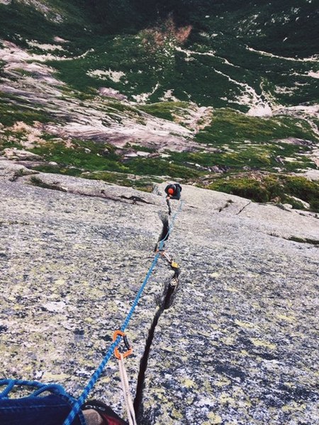 Andrew Kontola coming up the first pitch of the Flatiron withe the valley beneath Katahdin below, July 2018.