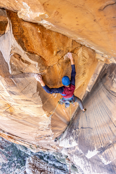Harrison Teuber finishing the P5 arete on The Shuffle