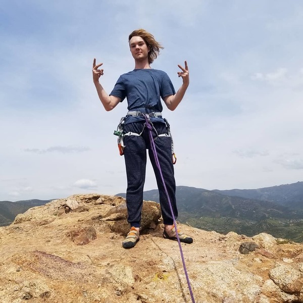 Matthew standing on the summit after following me up Goldline on a windy Tuesday afternoon.
