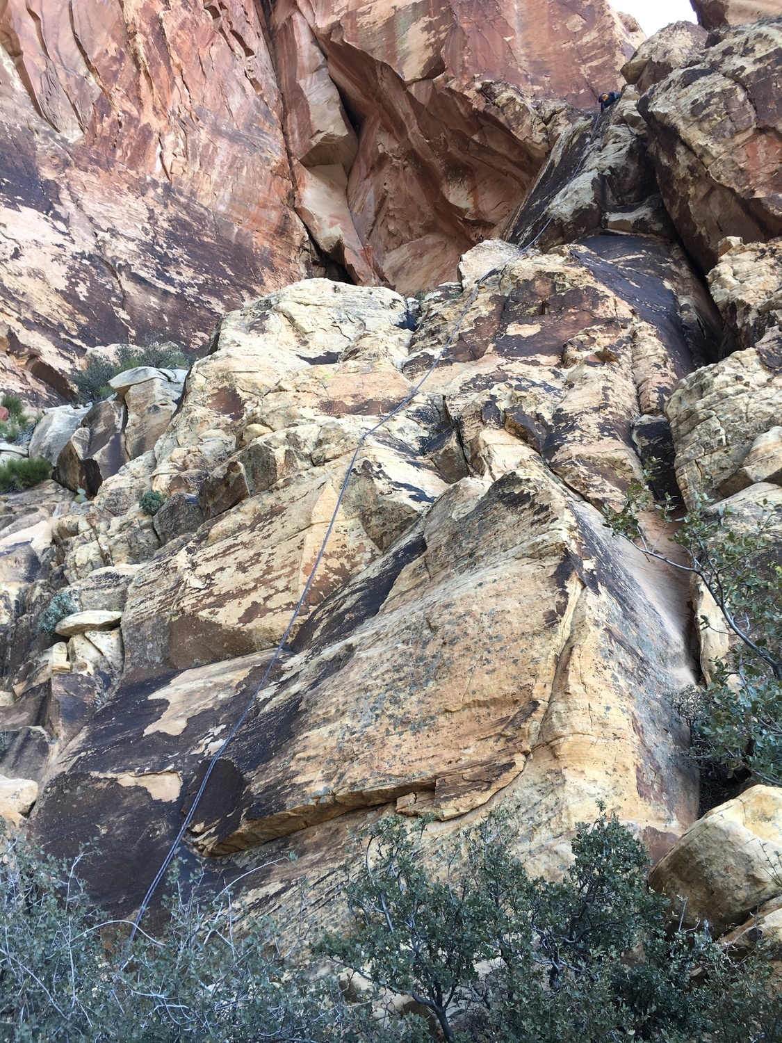 View of my partner rappelling down to the notch from the rap sling