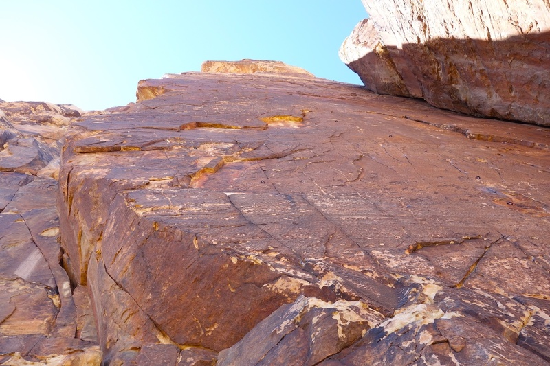 Spirit Air climbs arete on left. Man of the People climbs the bolted line on the face just left of the Schwalli corner.