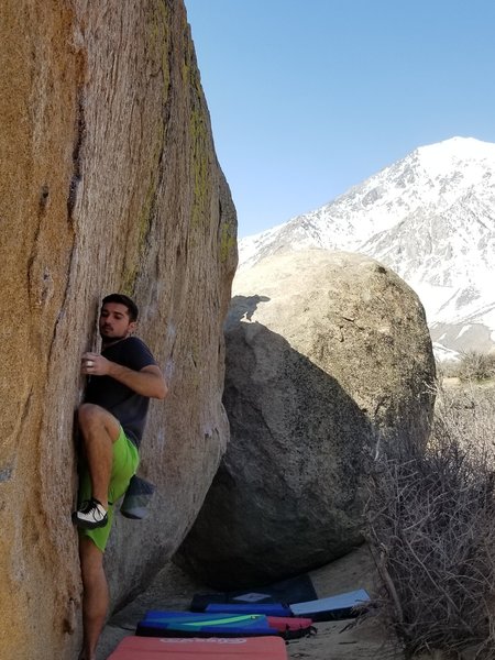 Finding the good undercling above the left hand start hold.
