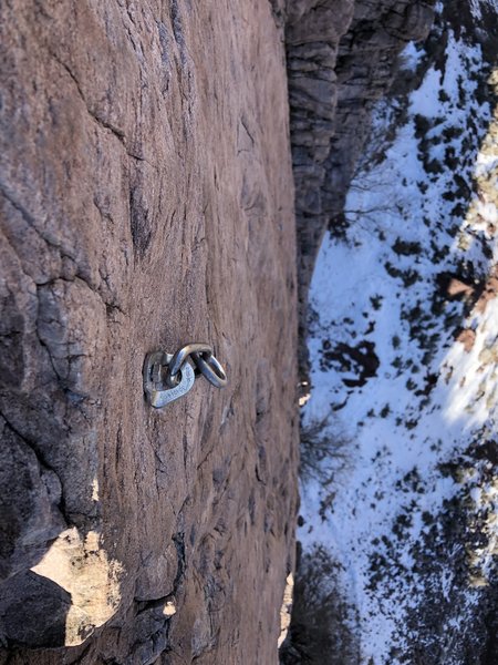 Only one bolt at the top. You can see where the old bolts were.