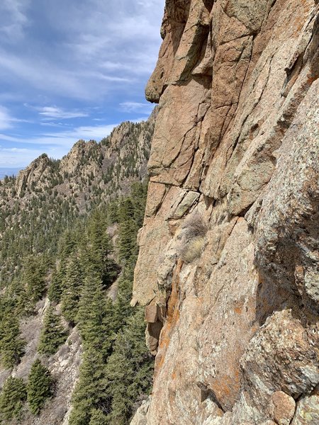 The traverse left on pitch 2 - head straight for the shrubs in the center and the cave will be directly above.