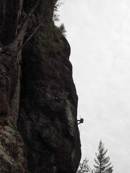 There's plenty of tall climbing at Bolton Dome. An unidentified climber rappels to the Neighborhood Ledge from 2 pitches up.