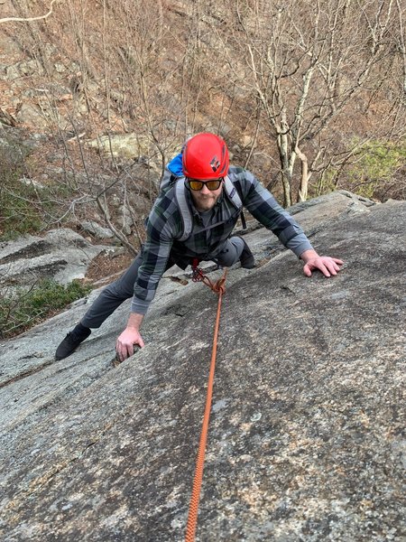 Aaron contemplating his next move near the top of Slabtastic... Wearing Xero shoes...