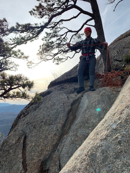 Aaron starting to coil the rope after a fun toproping session on Begginer Slab. Picture taken from the bolt anchor.