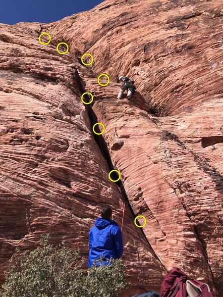 Making the traverse. Might be able to reduce rope drag by putting a piece high in the left crack before traversing over to the right crack rather than traversing low like I am doing in the picture.