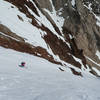 Skiing the Mendenhall Couloir amidst colorful rock