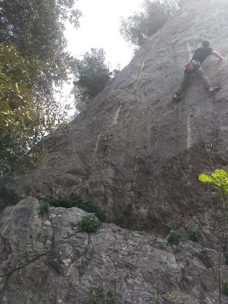 CLimber on the 6c in the center of the wall, 5b bolts visible (sorta) slightly to the left.