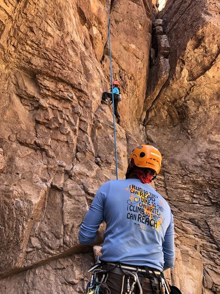 Neil, my son of 8 climbs as I belay
