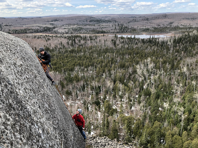 Noah K belaying Connor K right after he worked through the crux.