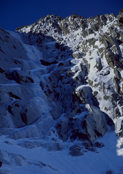 A foreshortened view of the route from the end of the approach. Out of view above the last icy section is the upper snowfield as the route kicks back.