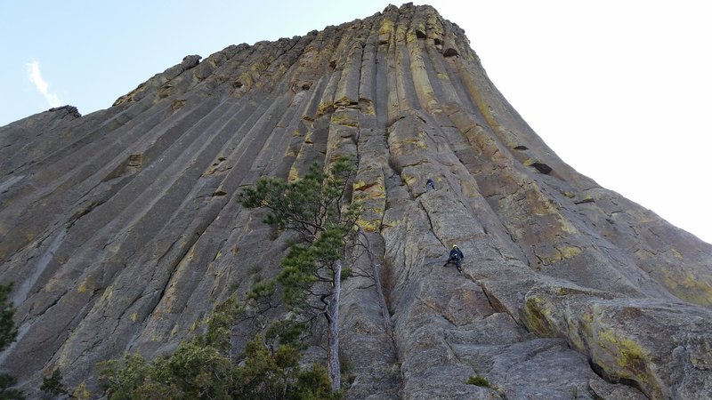 Dan (yellow helmet barely visible) at the top of P2, Grace (white helmet) at the top of P1, Emma climbing up P1. If you zoom in to see the ropes, this shows how pitch two wanders left.