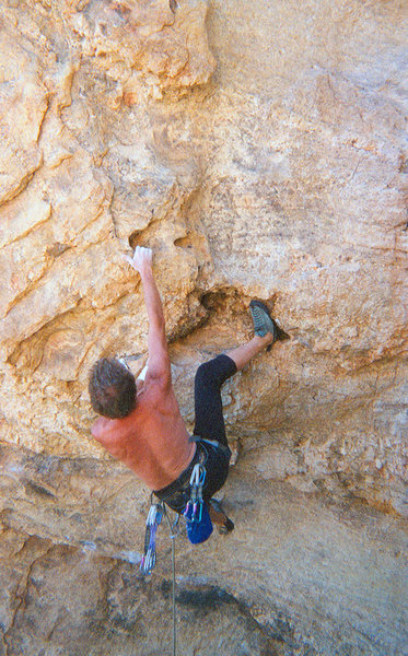 The first crux on Liquid Jesus. That right hand hold is a bit like grabbing a hatchet blade. The real crux is on the vertical face above. Photo: Guy Keesee.