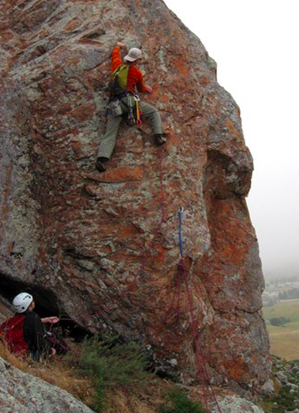 Slater climbing pitch 4 (Hobbit Arete) of The Backdoor. You can use the lower bolt as an anchor for a belay.