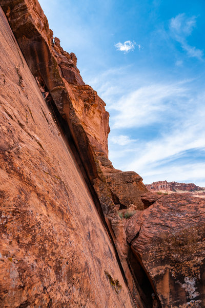 Josh Weinstein blowing choss on the second ascent, but the first naked ascent