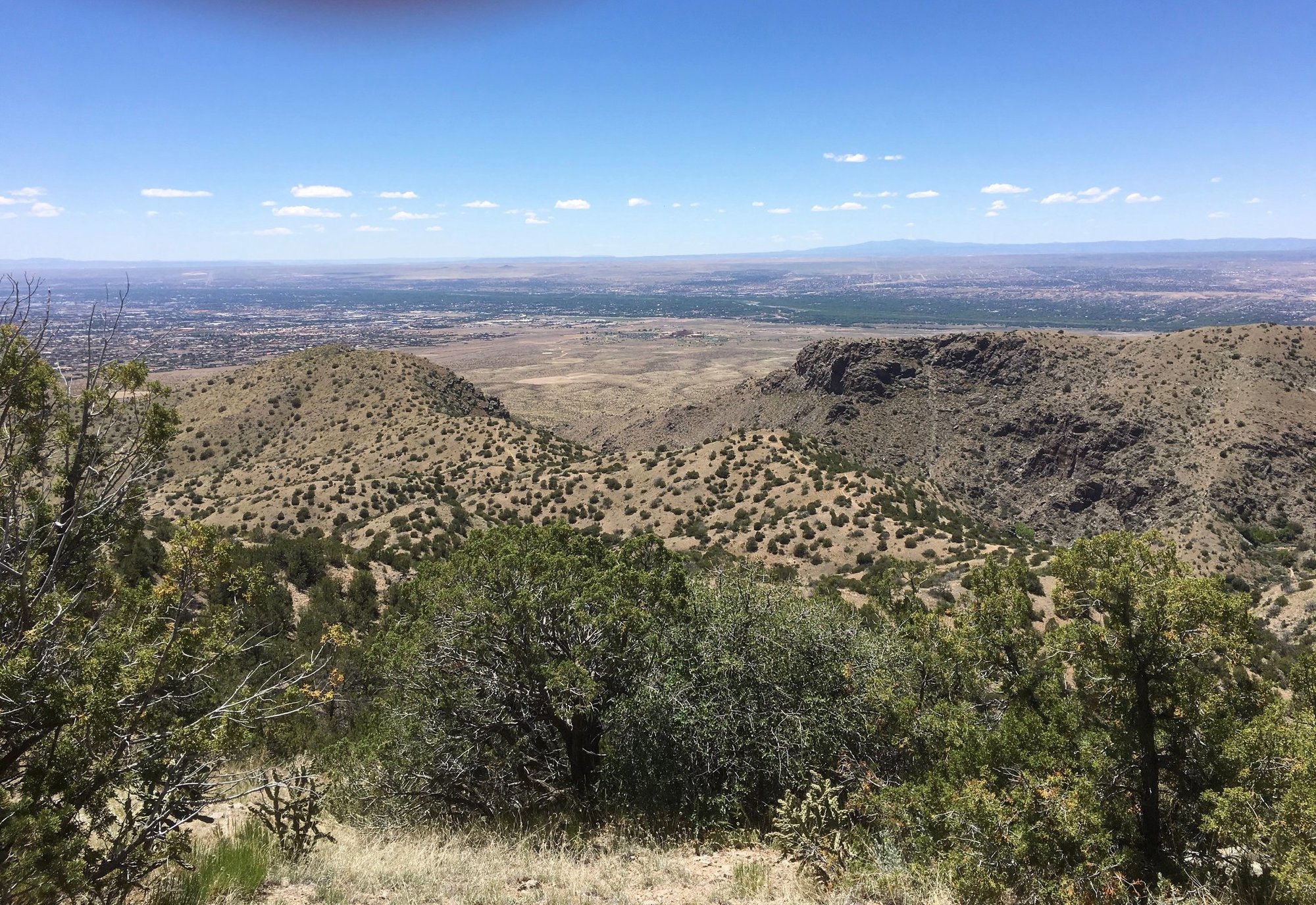 Trail going into Juan Tabo Canyon between the two hills in the center