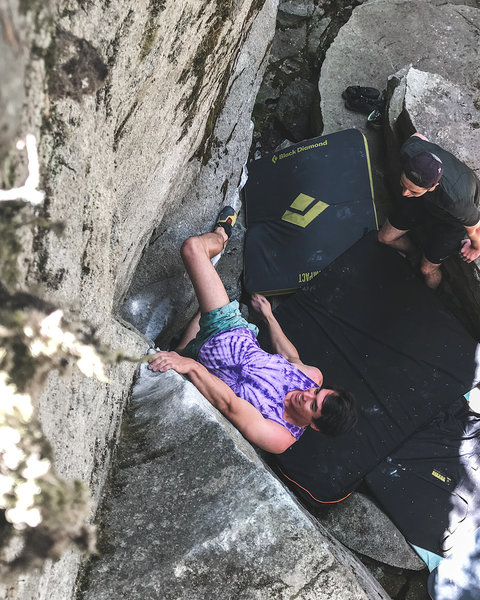 Jamie cheesing after latching the arete on the low start of Dining in Hell