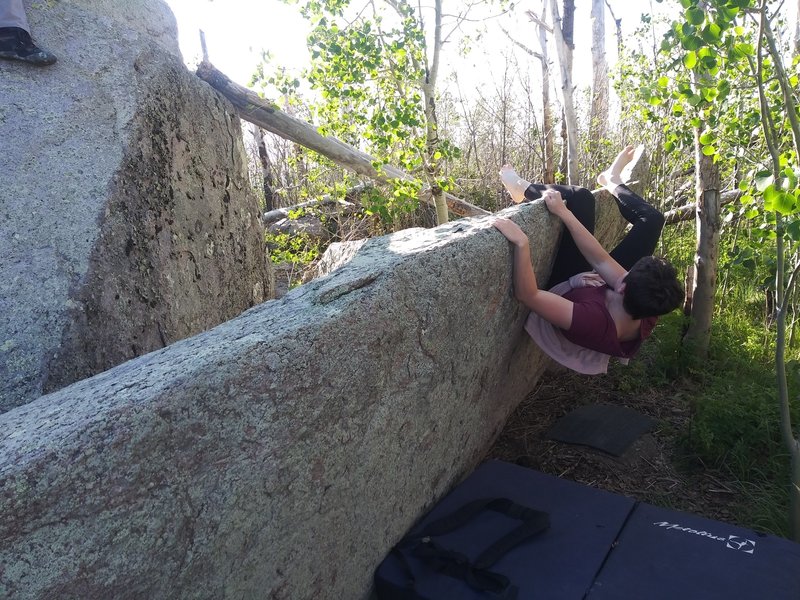 Kayleen working in multiple heel hooks as she gets 1/3 way through the climb.