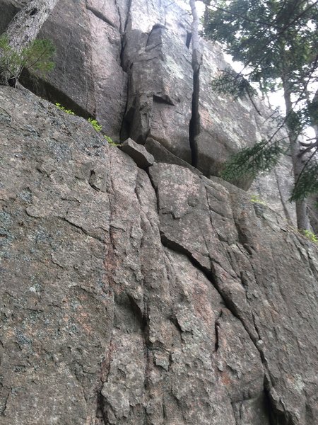Alley Ouff is the off width crack on the right. Ragged Edges is the crack to the left. A bolt protected face below leads to either of these two routes.