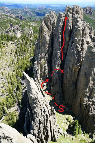 The route we took. Walk up to where the first arrow ends (the S is for Start, which I realize in retrospect is stupid and confusing) and do short up and over chimney to get to the chockstone ledge. Up from there for 2nd pitch. .