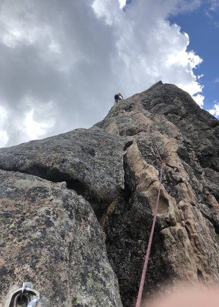 Gramps nearing the top of P2. Look for this type of wavy rock around the 1st-3rd bolt of P2 (if using a 60m) to help find this route and not accidentally hop on the others nearby.