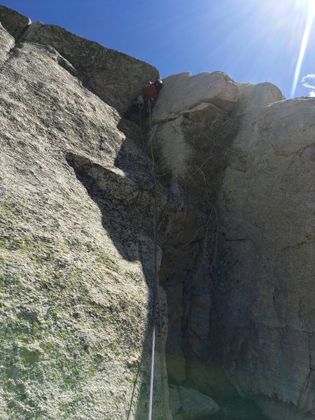 Poor lighting, but a photo of Andy wrangling the roof on Pitch 8.