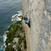 Jake Noblett climbing The Sublime and the Ridiculous (26/7b ) at Windjammer Wall, Point Perpendicular